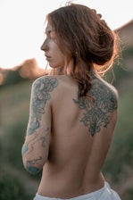 A woman with a tattoo on her back