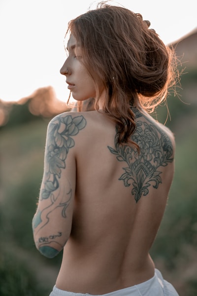 A woman with a tattoo on her back