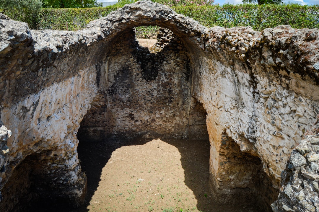 A large stone structure with a hole in it,