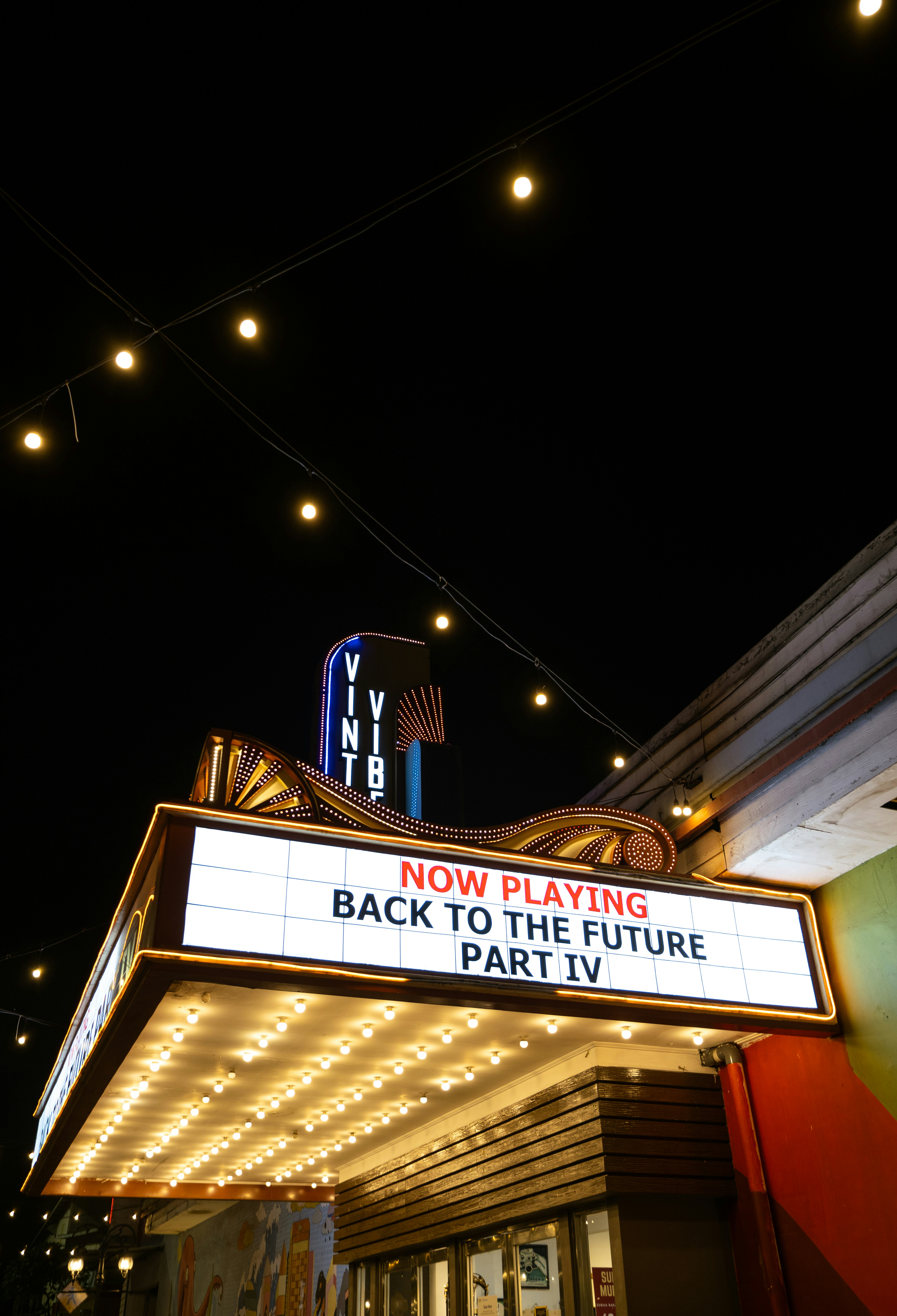 A theater marquee lit up at night