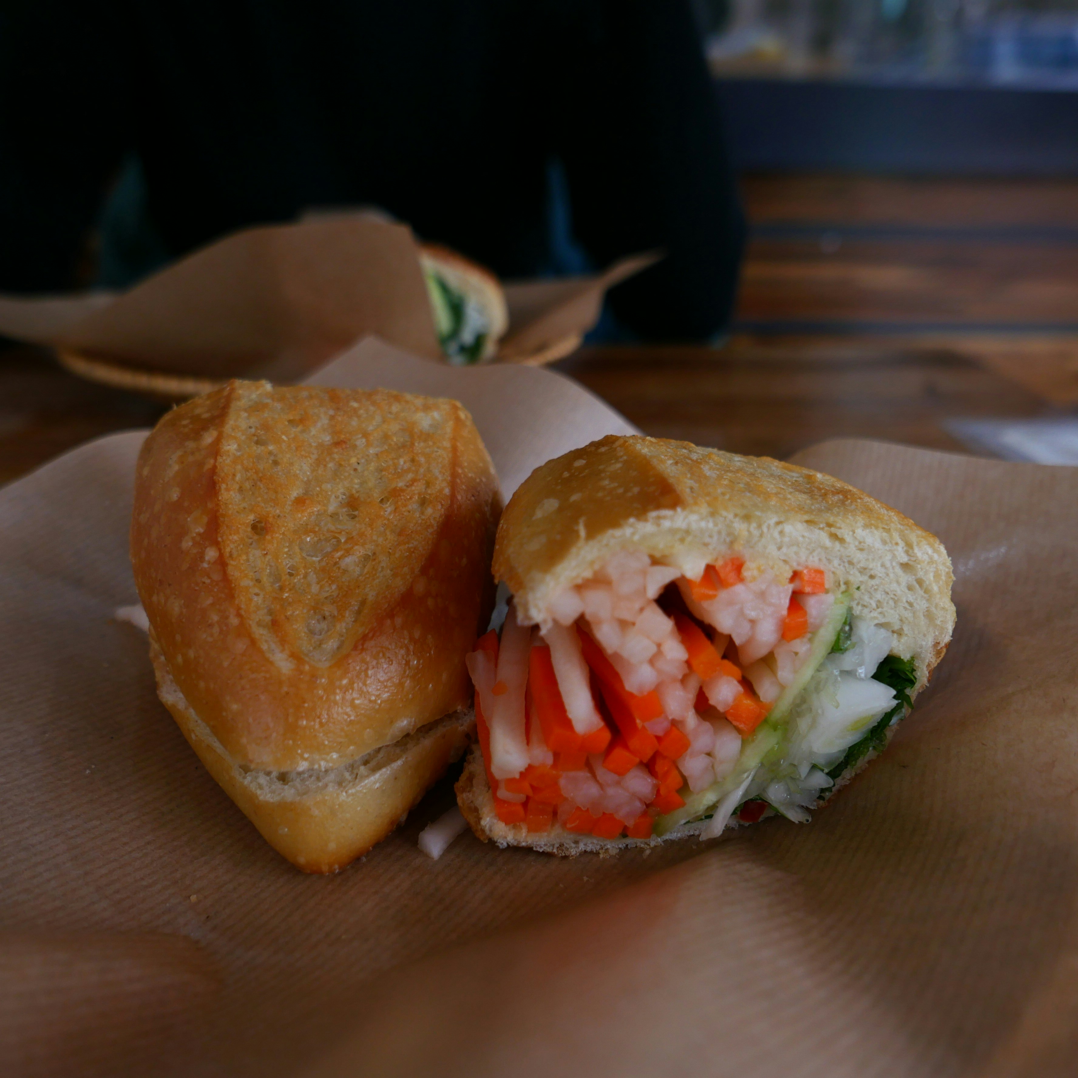 A sandwich cut in half sitting on top of a table