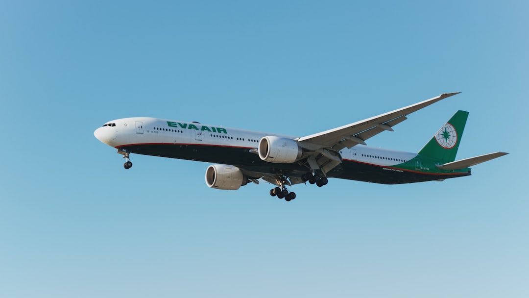 A large jetliner flying through a blue sky, A plane