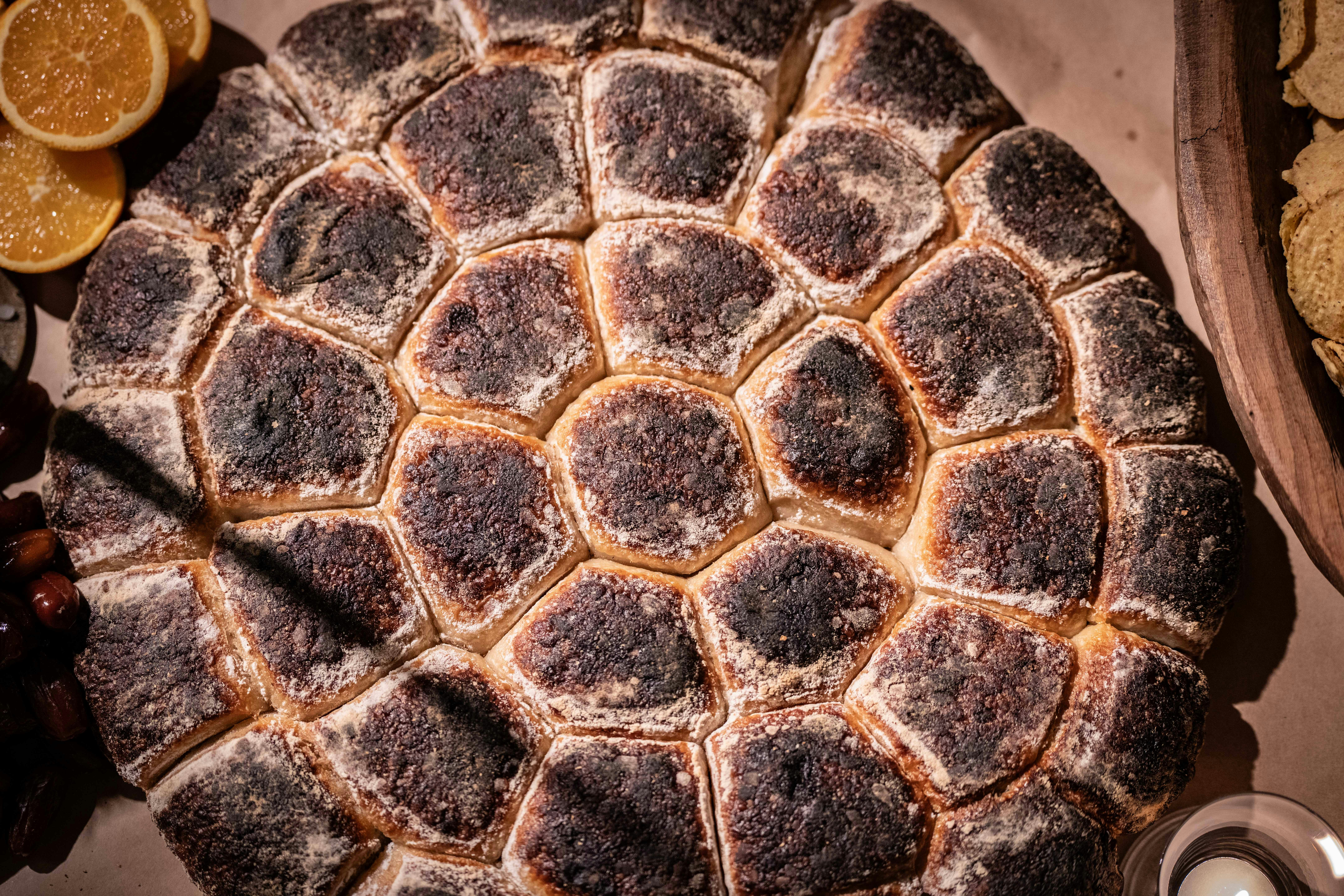 A table topped with a cake covered in icing