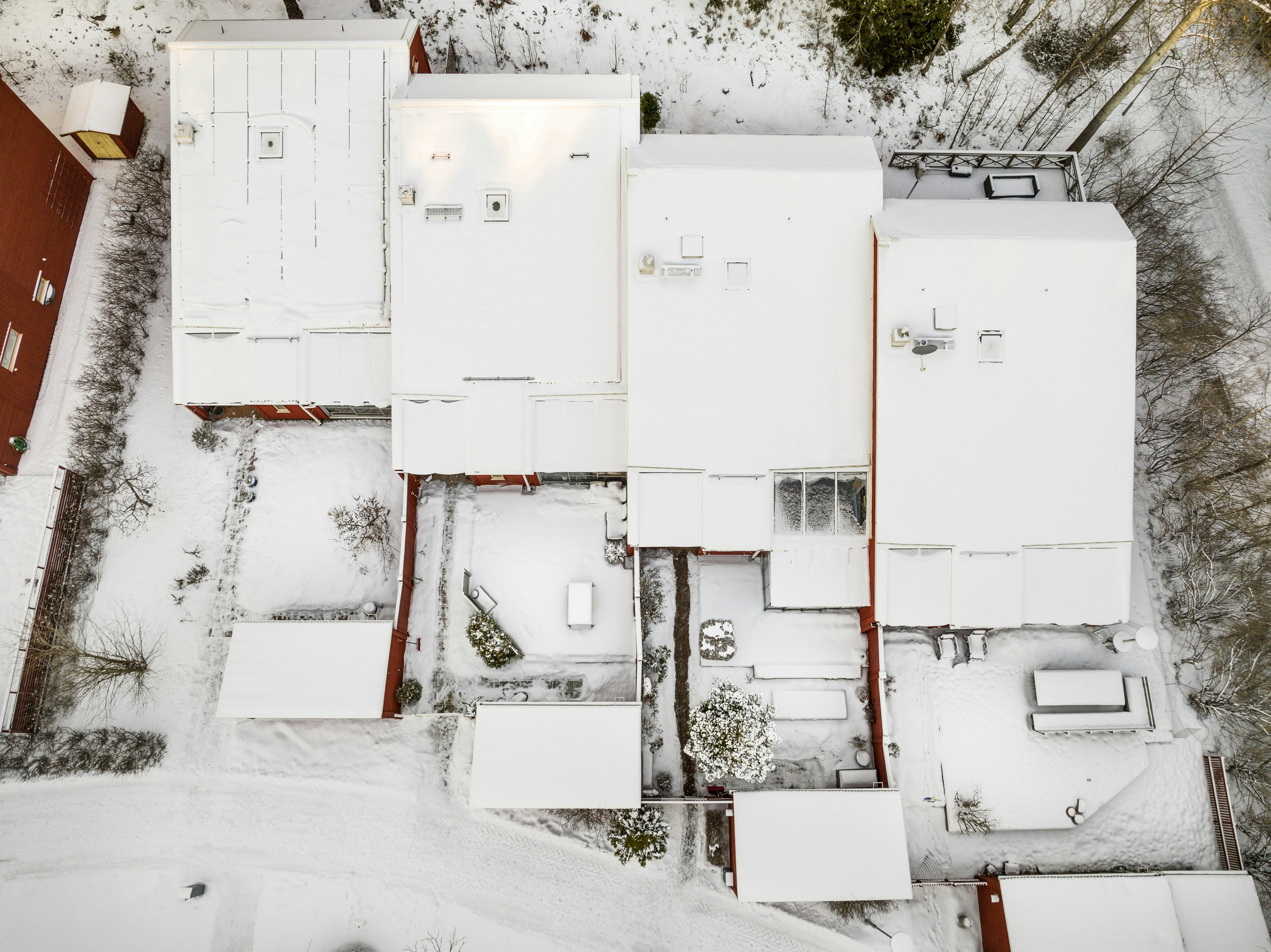 A large, complex commercial property with multiple obstacles for snow removal. - commercial snow plowing contracts