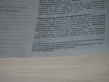 A close up of a book with writing on it