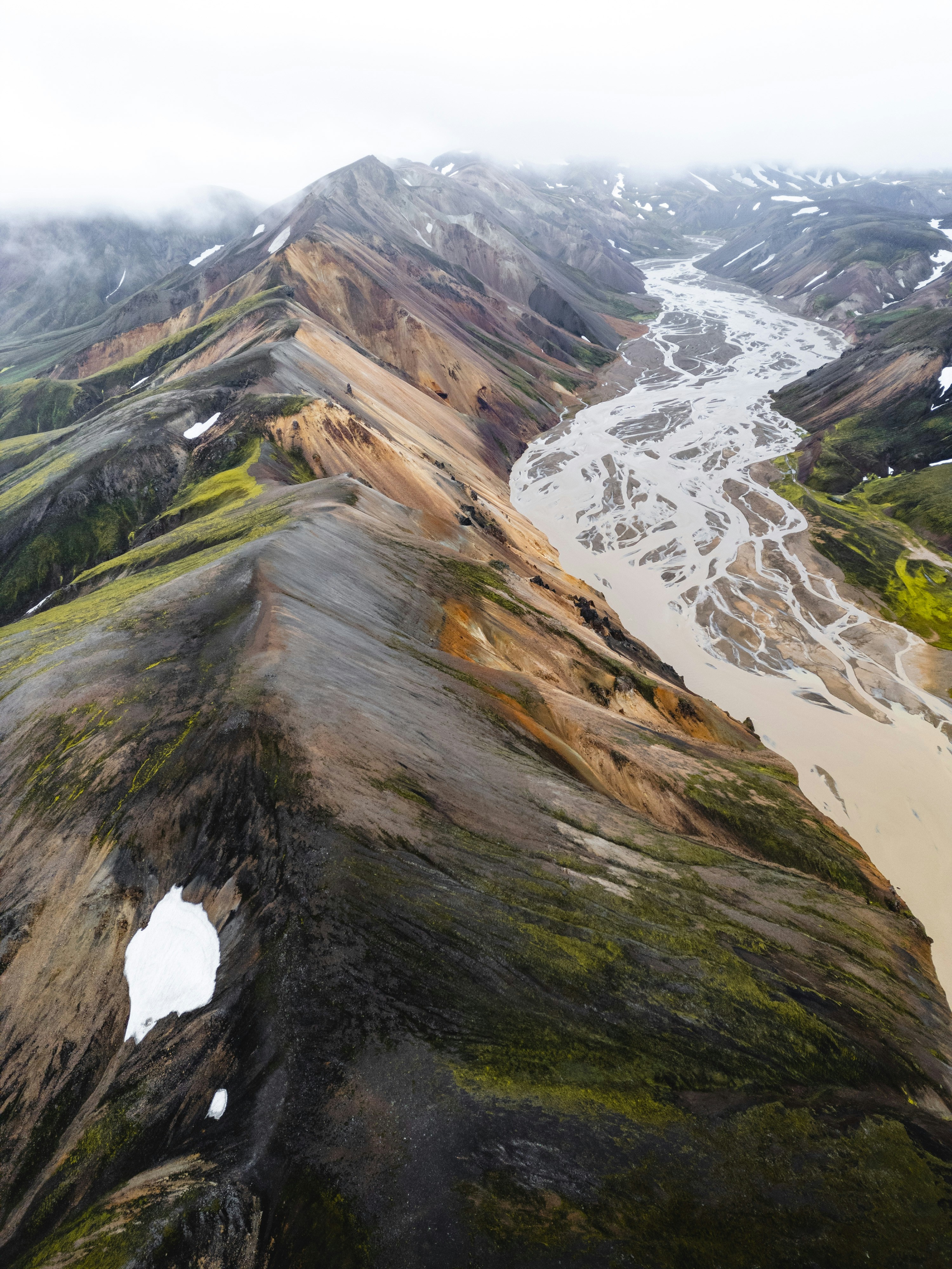 An aerial view of a river and mountains
