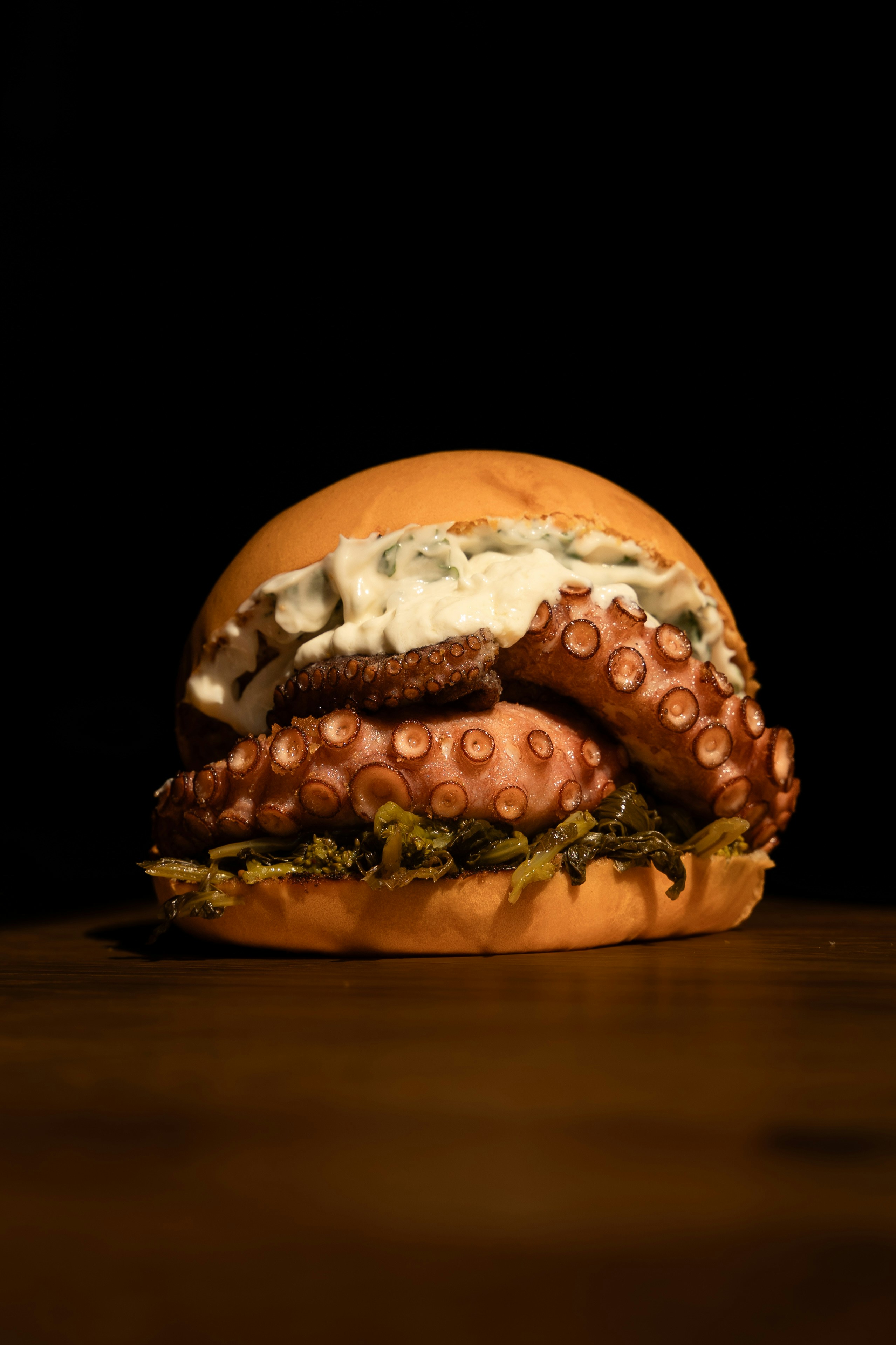 An octopus sandwich is sitting on a table