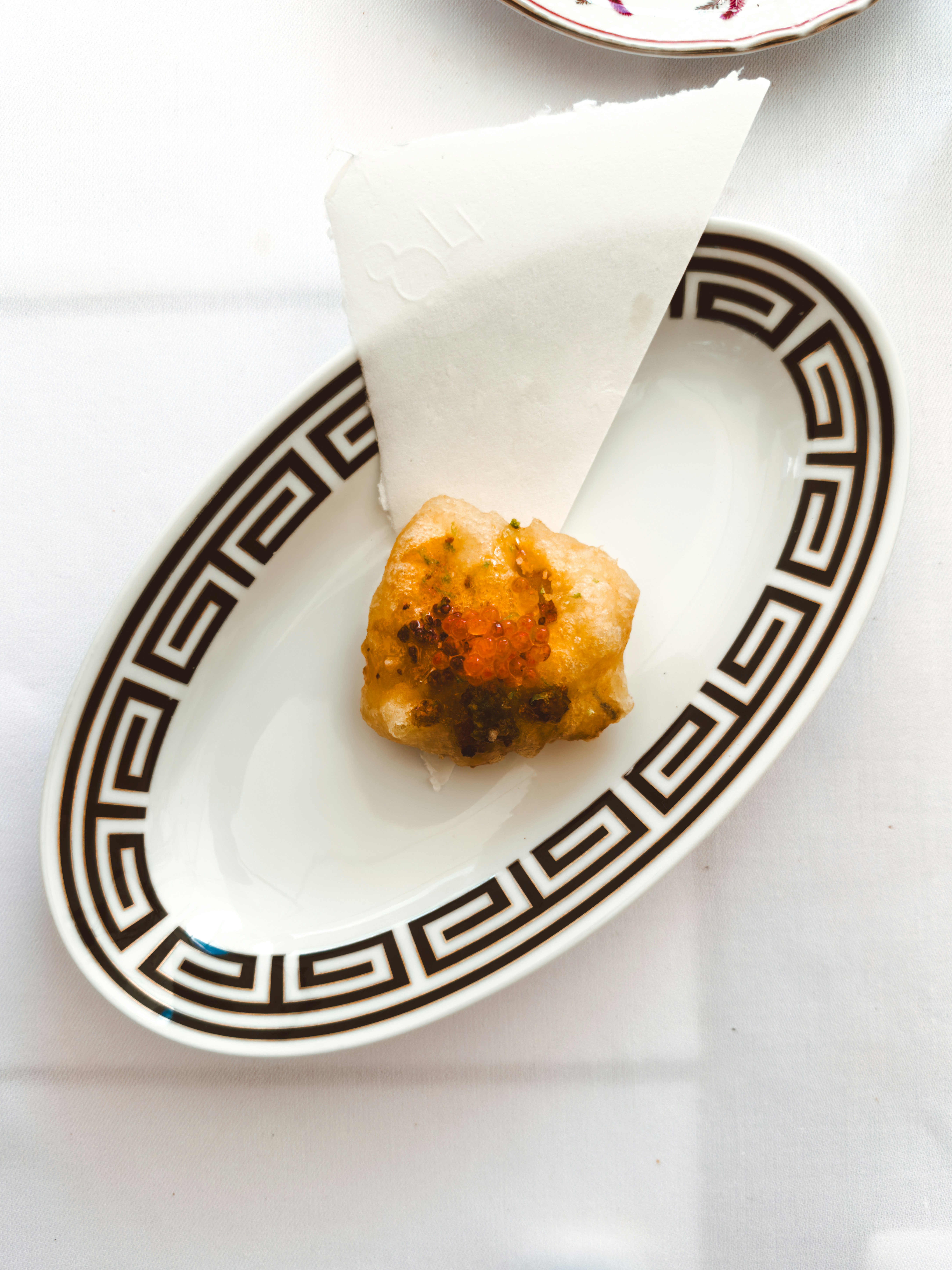 A plate with a piece of food on it