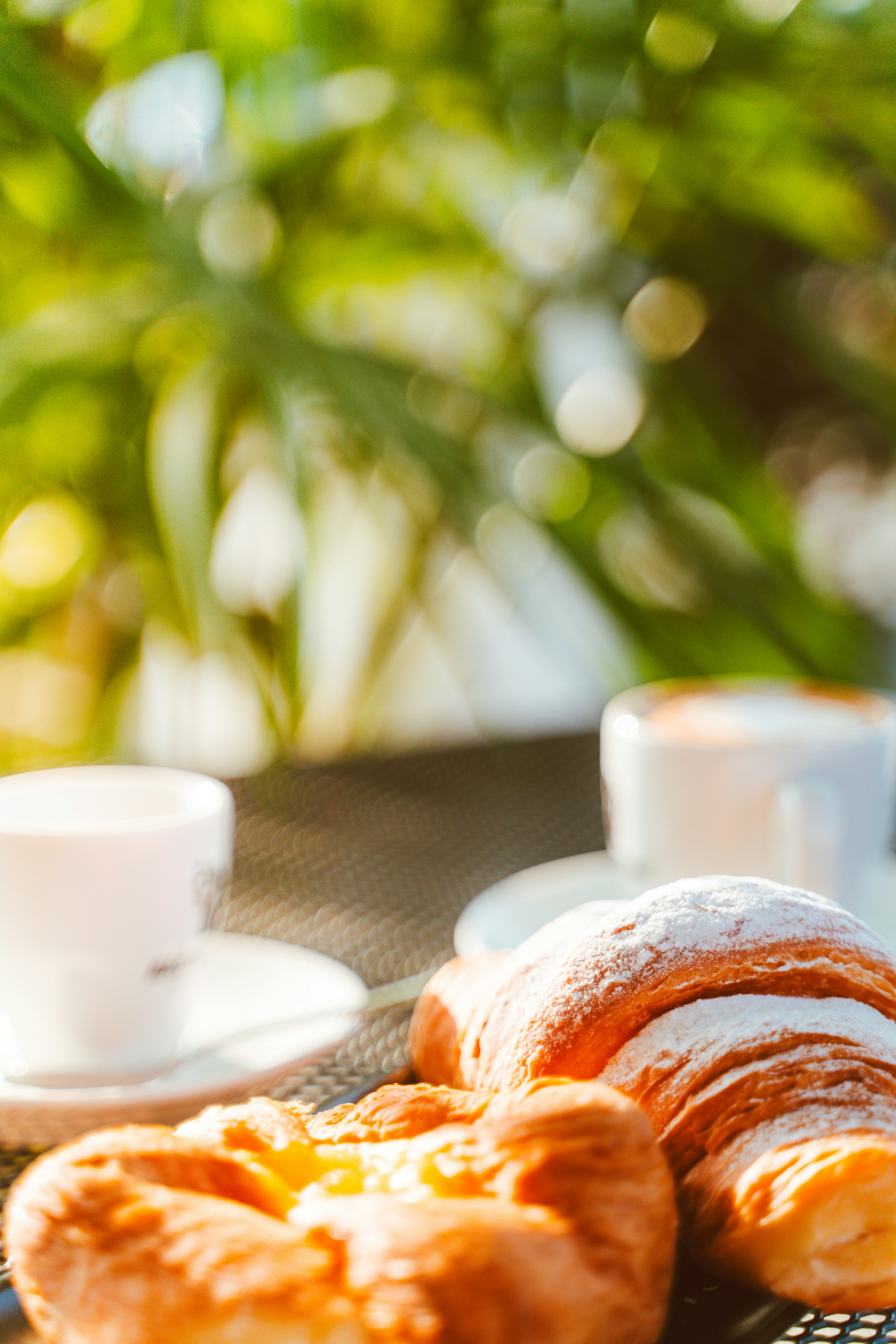 A couple of croissants sitting on top of a table