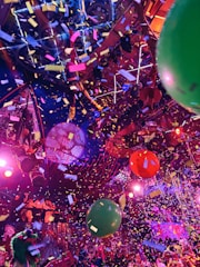 A bunch of balloons that are in the air