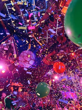 A bunch of balloons that are in the air