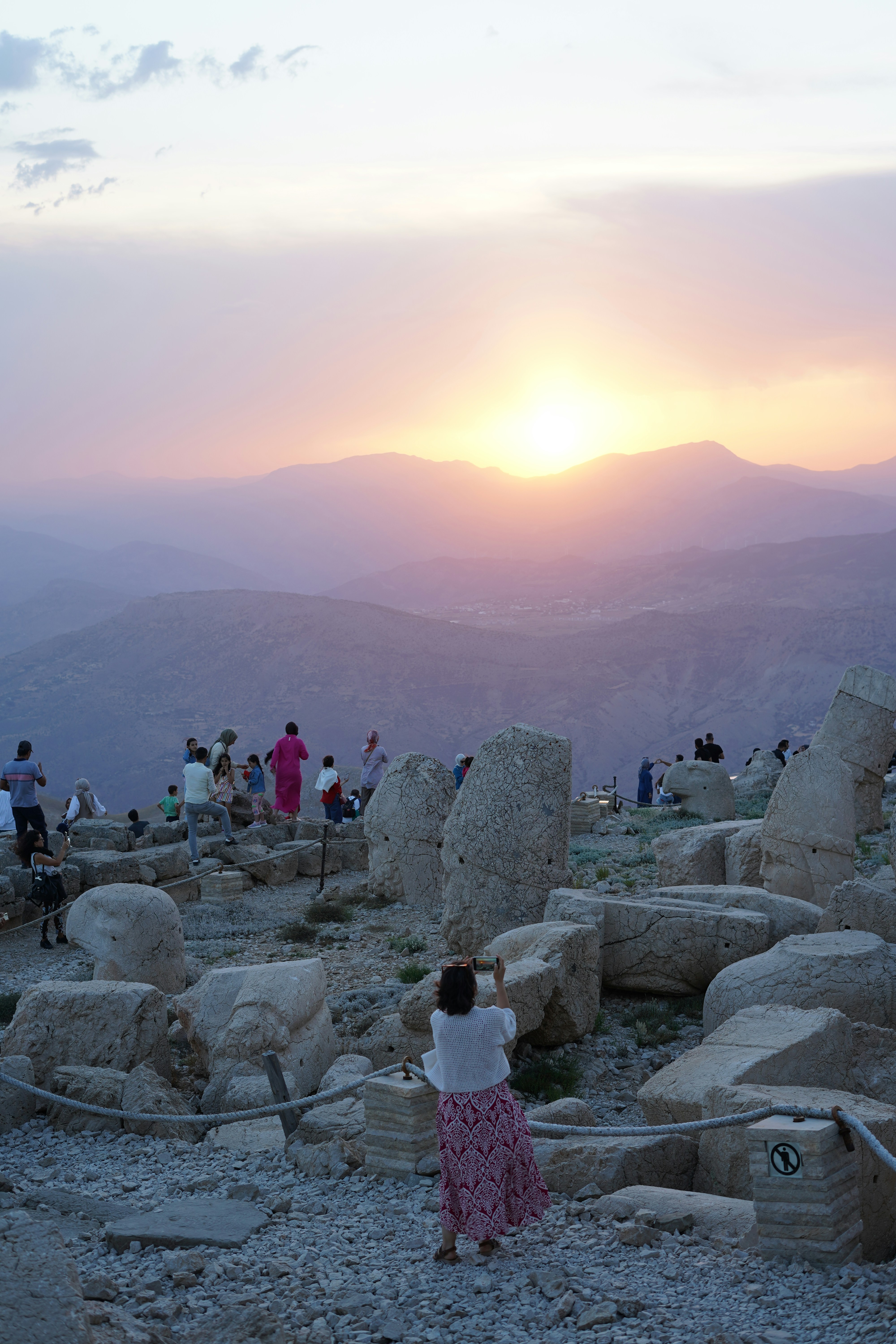 A group of people standing on top of a mountain