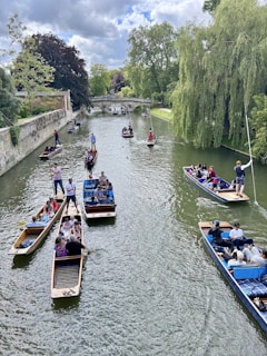 A group of people riding boats down a river