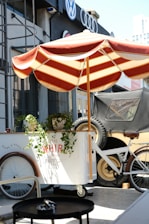A small cart with a bicycle parked next to it