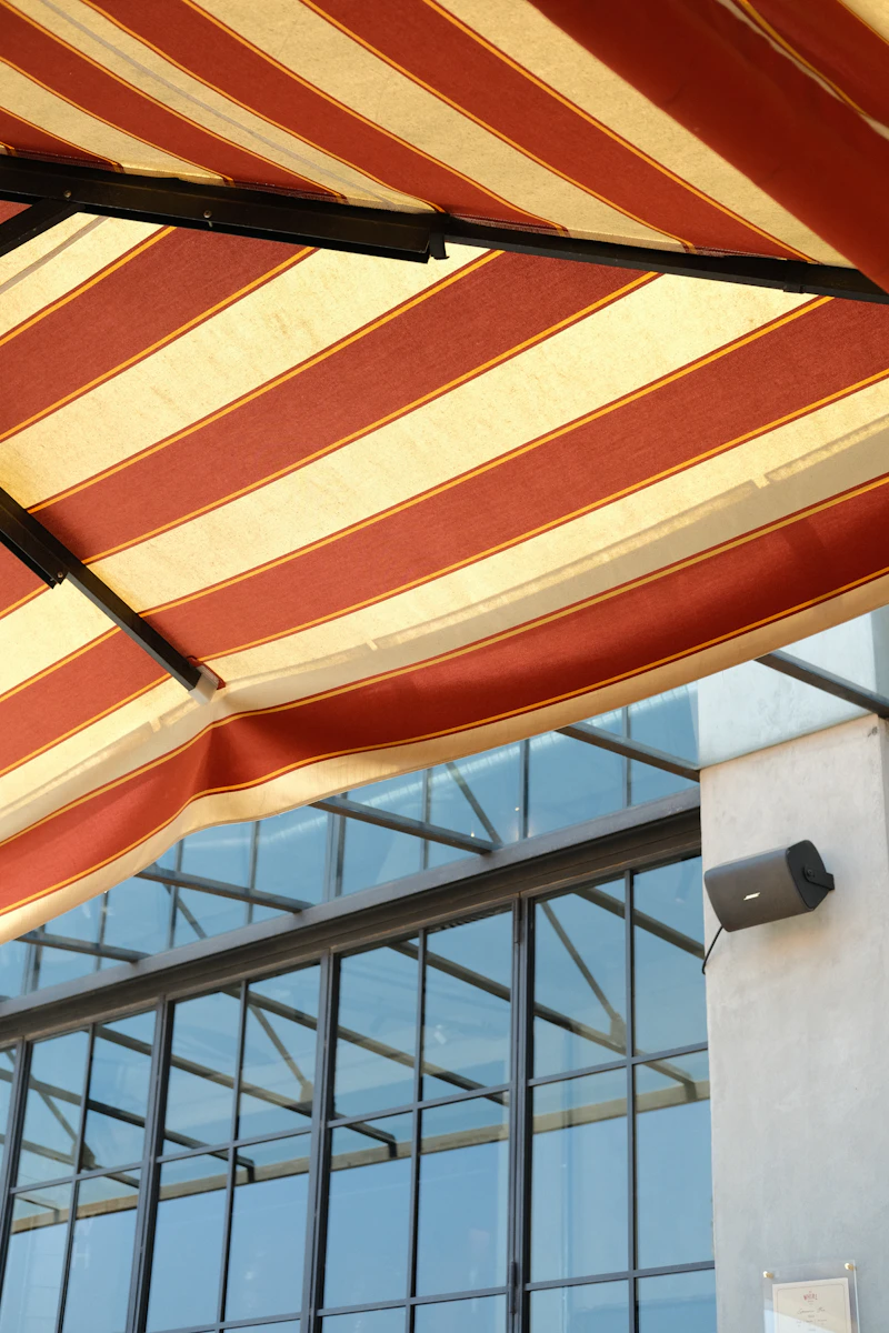 Red and cream awning underside showing fabric and frame replacement detail