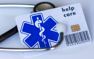 A medical card with a stethoscope on top of it