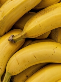 A pile of ripe bananas sitting on top of each other