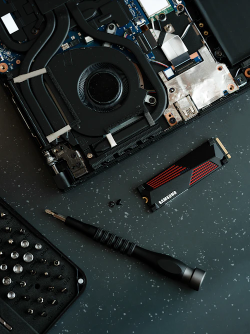 Laptop with a damaged keyboard being repaired