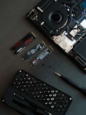 A broken laptop computer sitting on top of a table