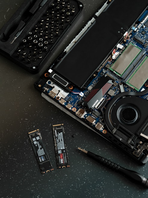 A broken laptop computer sitting on top of a table