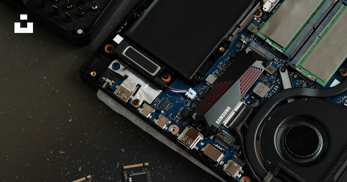 Labtop Assembly A broken laptop computer sitting on top of a table photo – Free Laptop ...