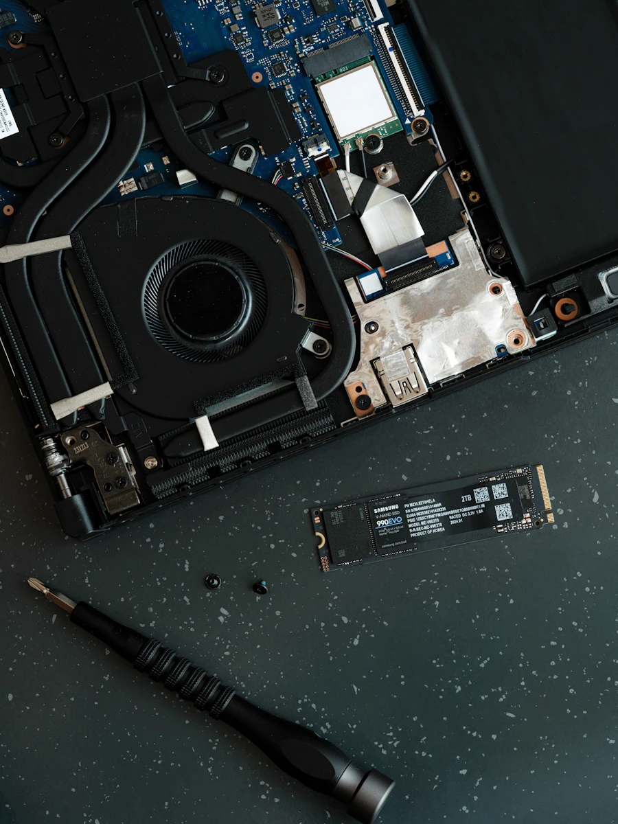 Laptop internals being examined during a diagnosis and troubleshooting service