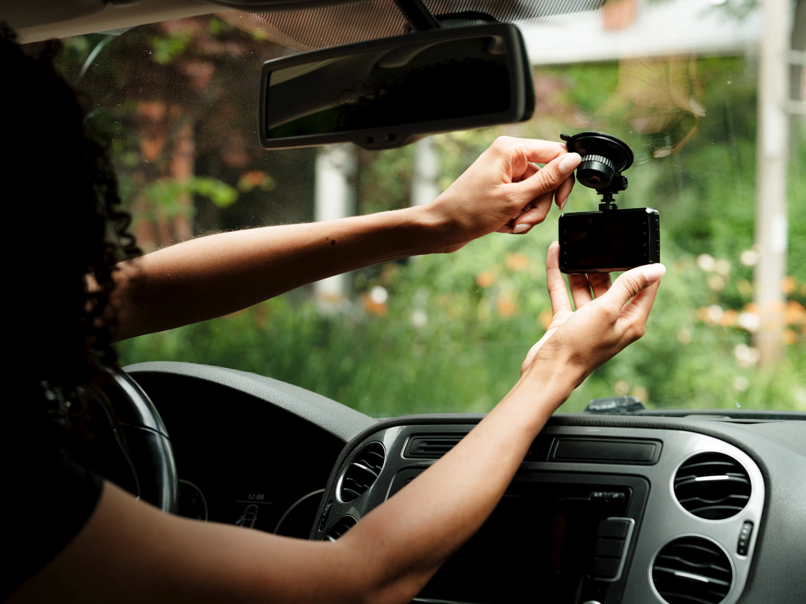 Dash camera being positioned inside a vehicle