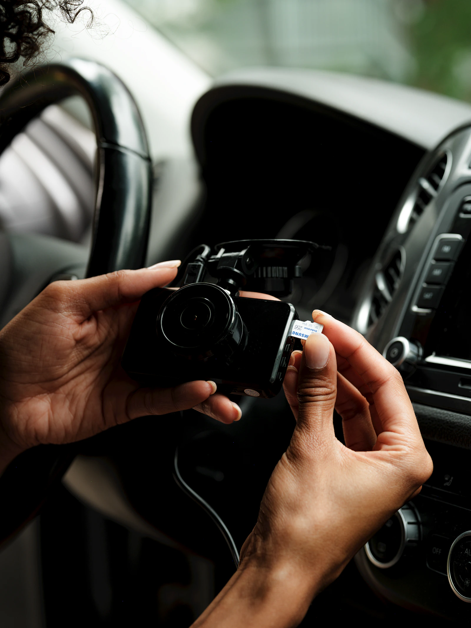 Automotive dash camera and memory card inside a vehicle