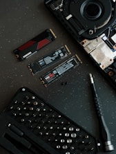 A keyboard and a pen on a table