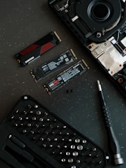 A keyboard and a pen on a table