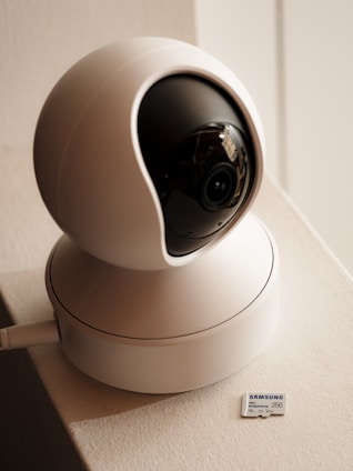 A white camera sitting on top of a counter