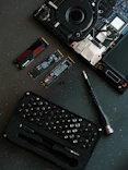 A laptop with a keyboard and a camera on top of it