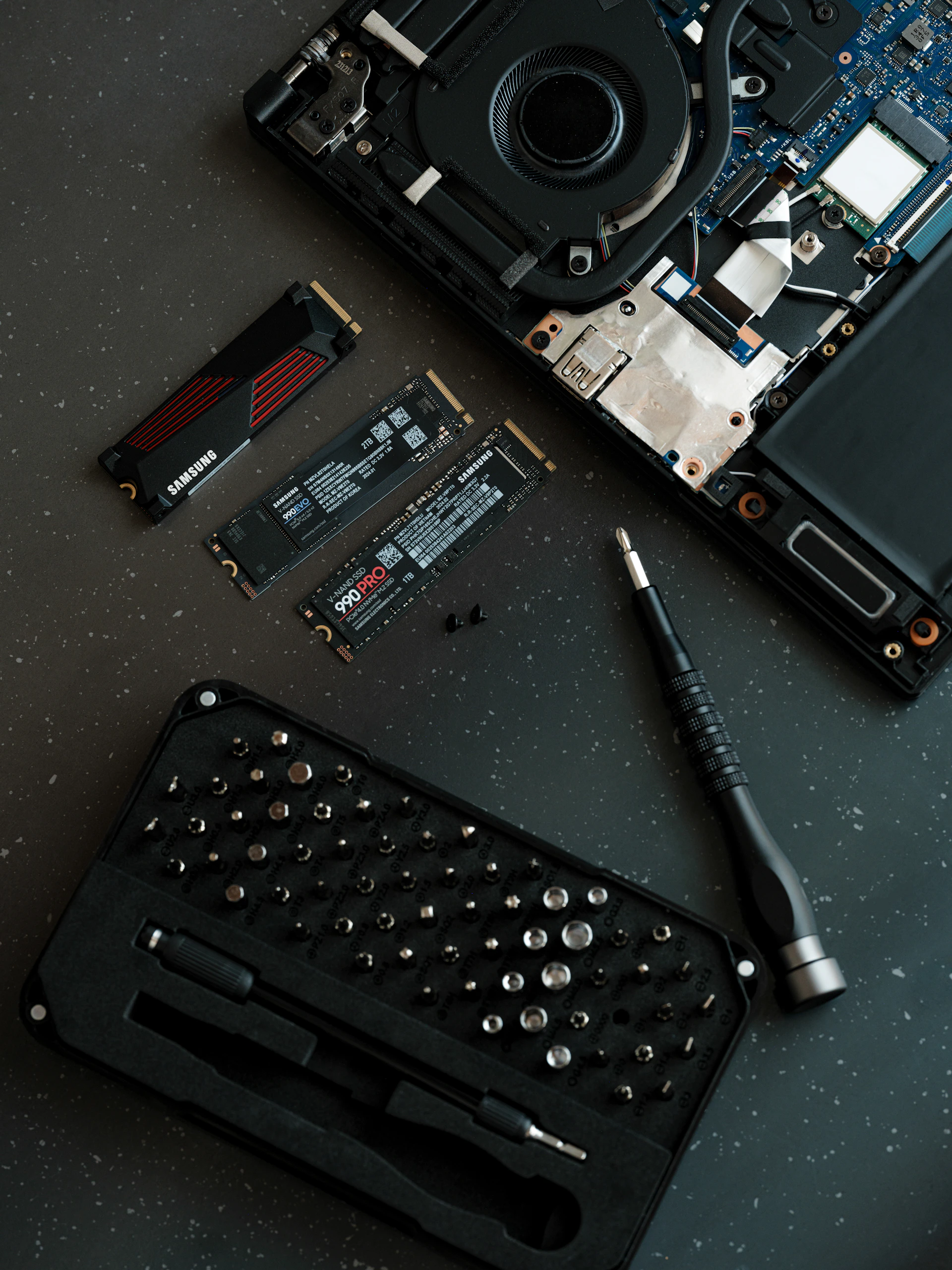 A laptop with a keyboard and a camera on top of it