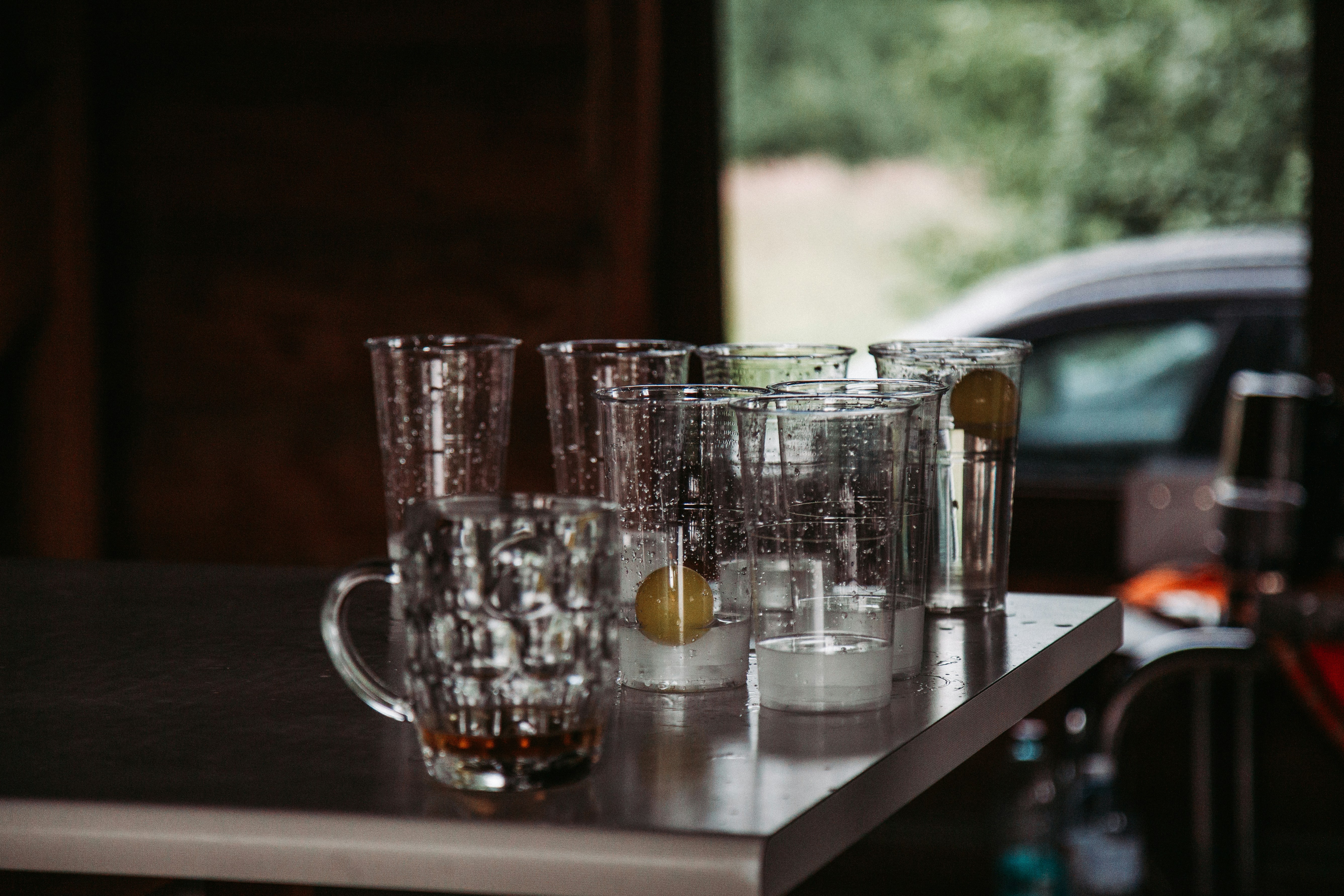 A bunch of glasses sitting on top of a table