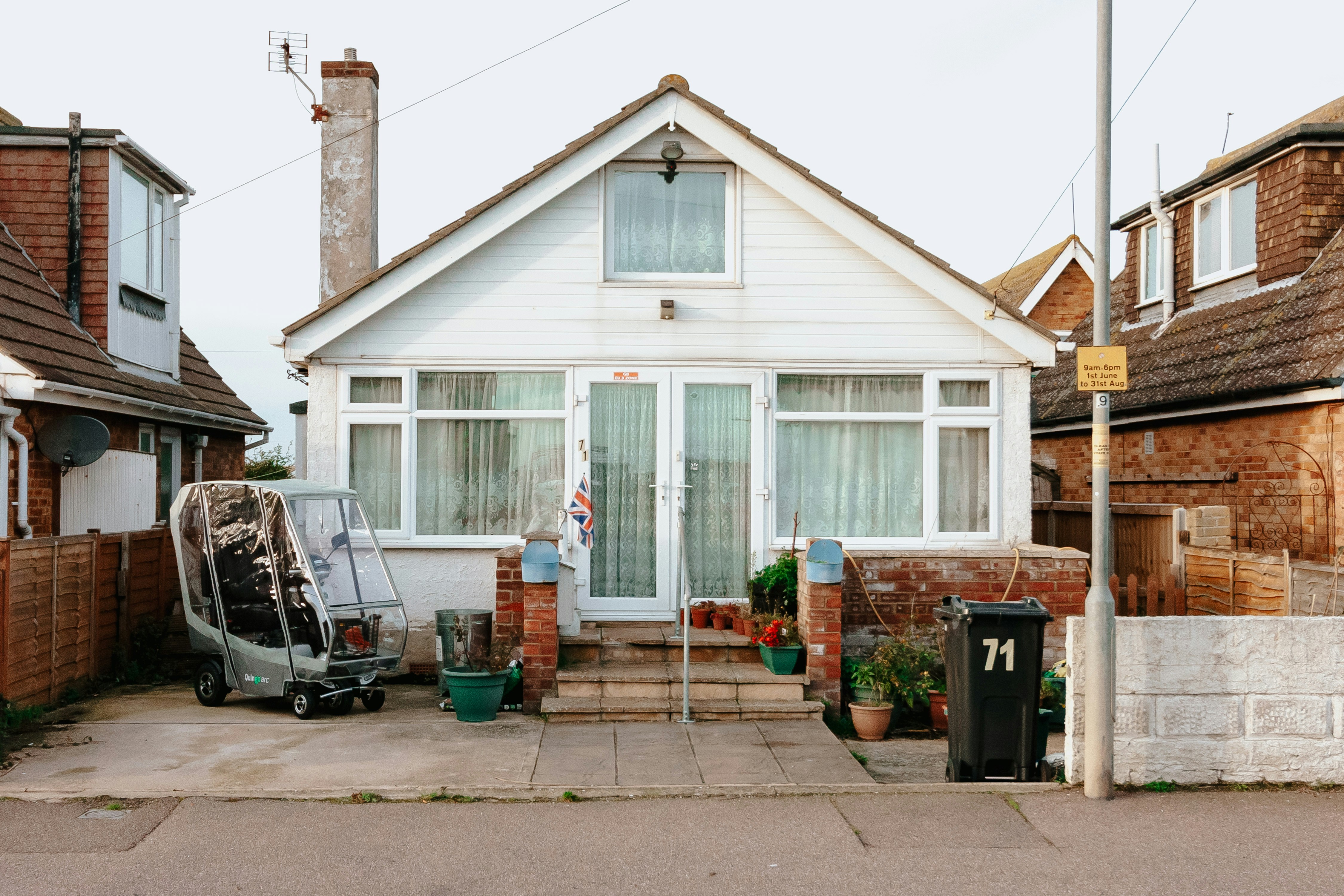 A house with a car parked in front of it
