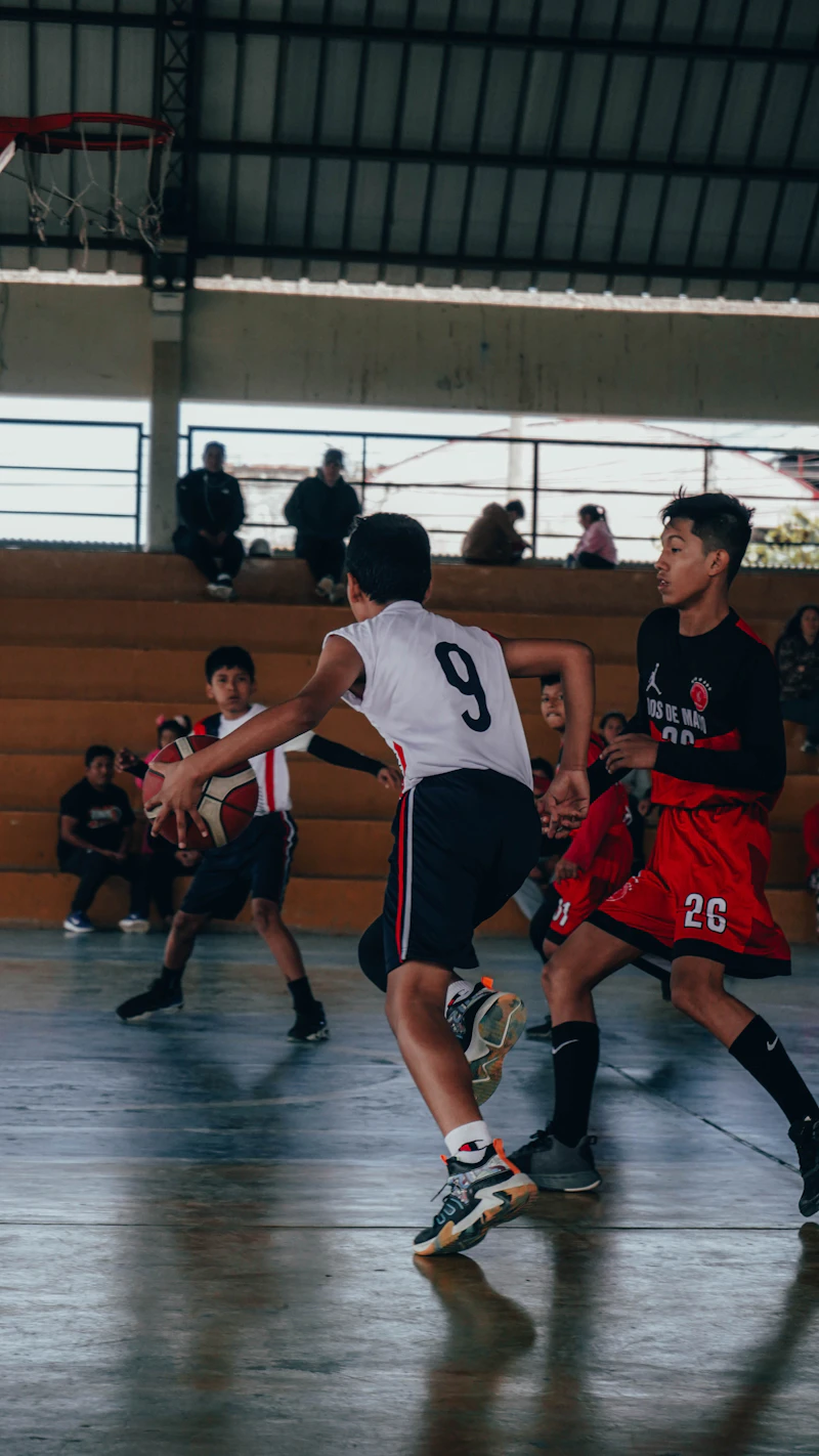 Young basketball players competing during a game