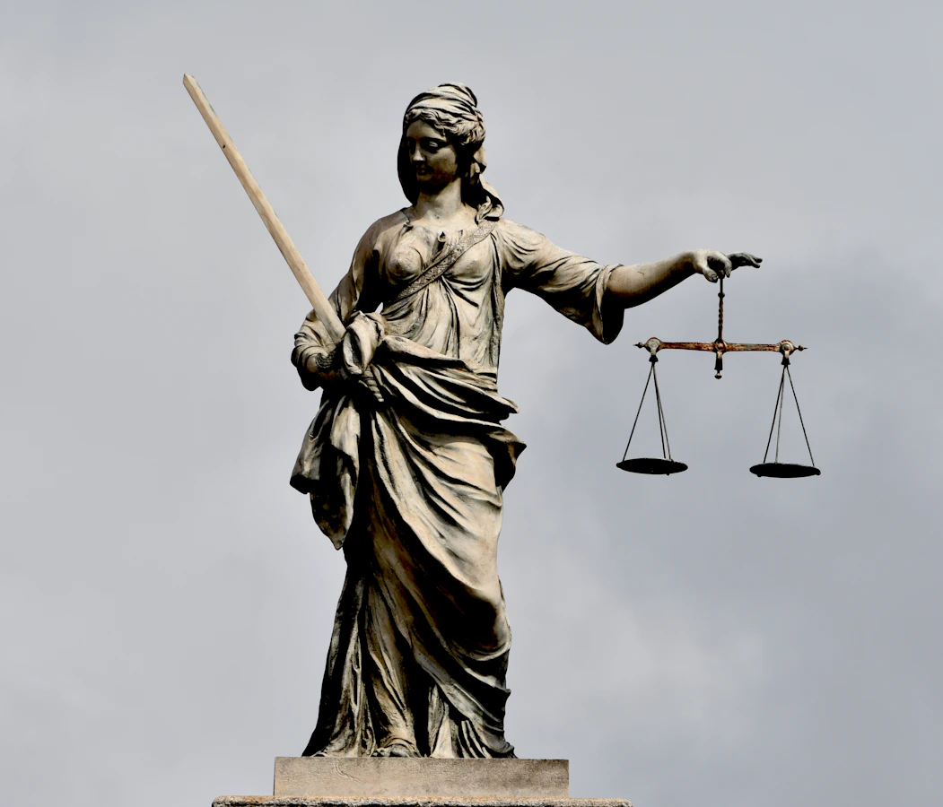 A statue of Lady Justice holding a sword and scales