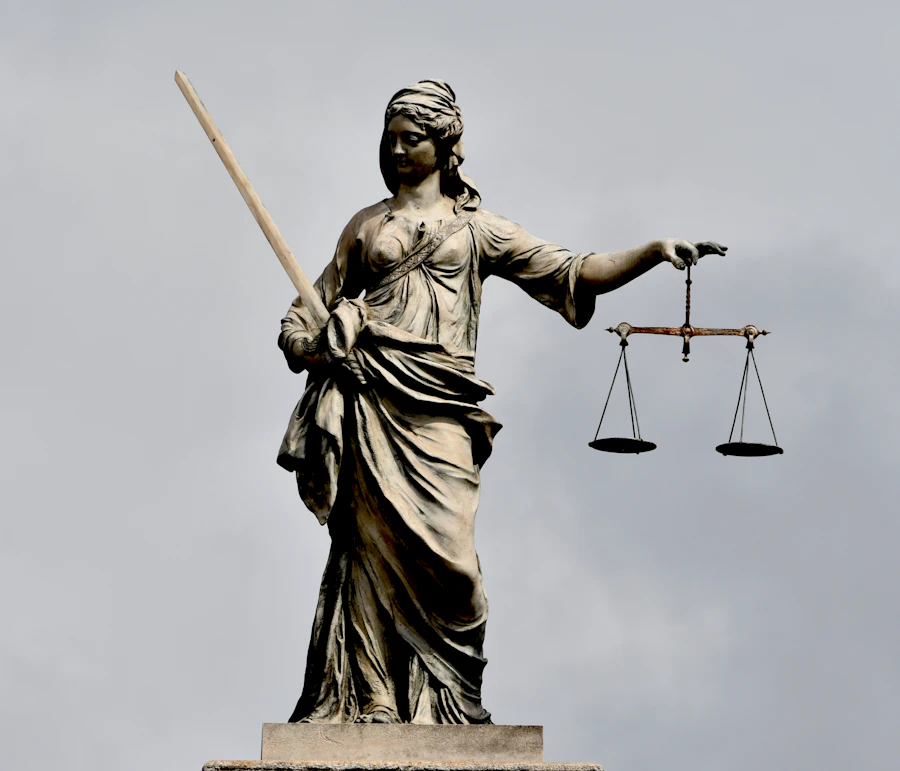 Statue of Lady Justice holding balanced scales