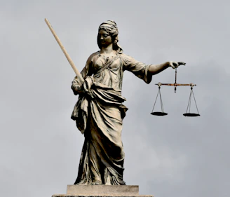 A statue of lady justice holding a sword and a scale