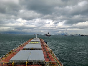 A large cargo ship in the middle of the ocean