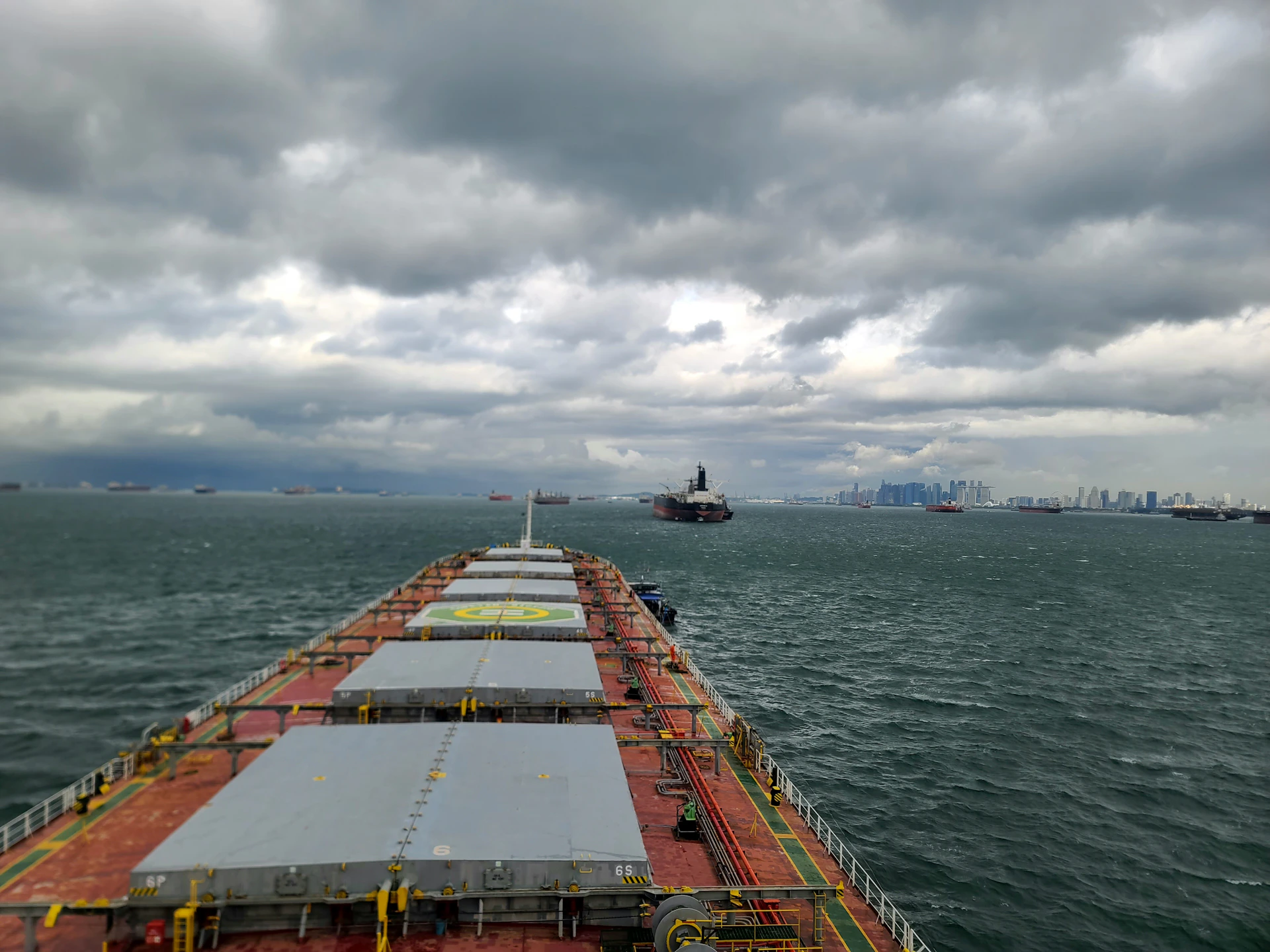 A large cargo ship in the middle of the ocean