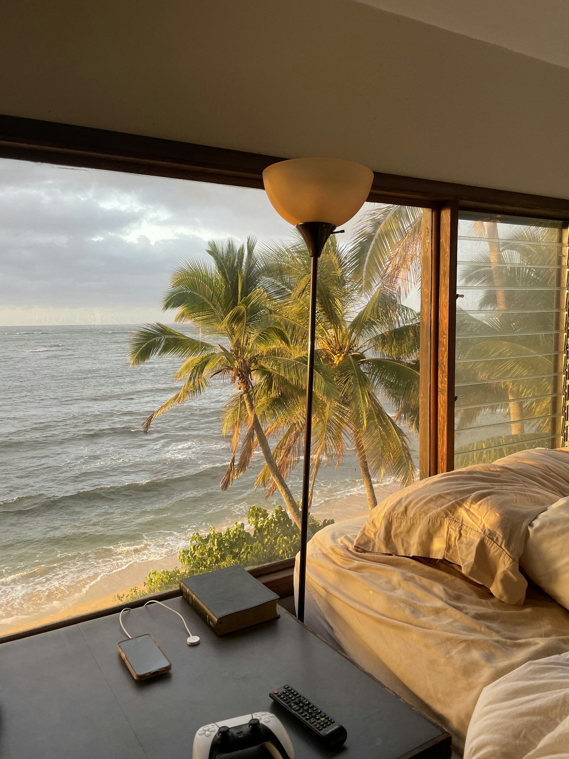A bedroom with a view of the ocean
