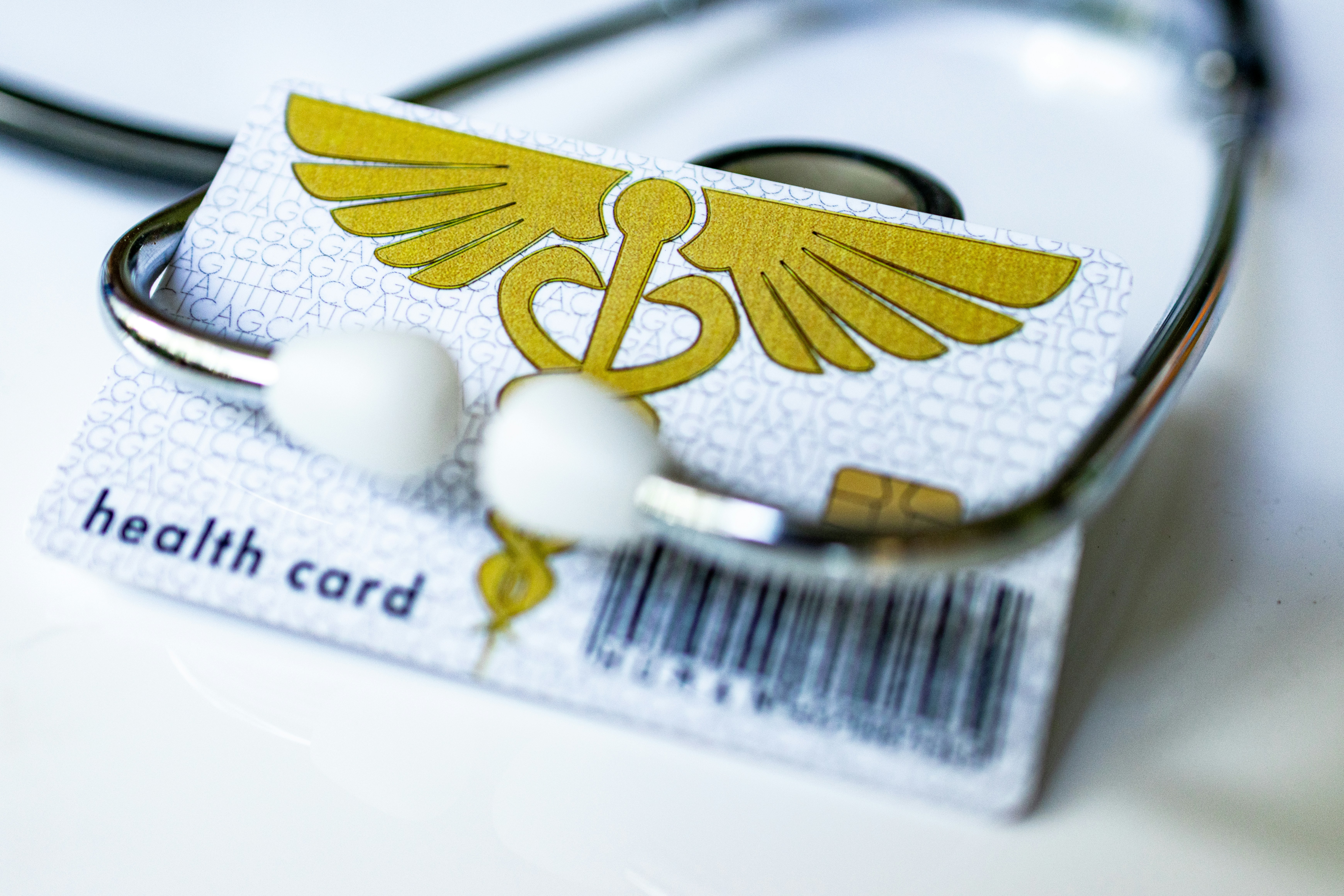 a health card and a stethoscope