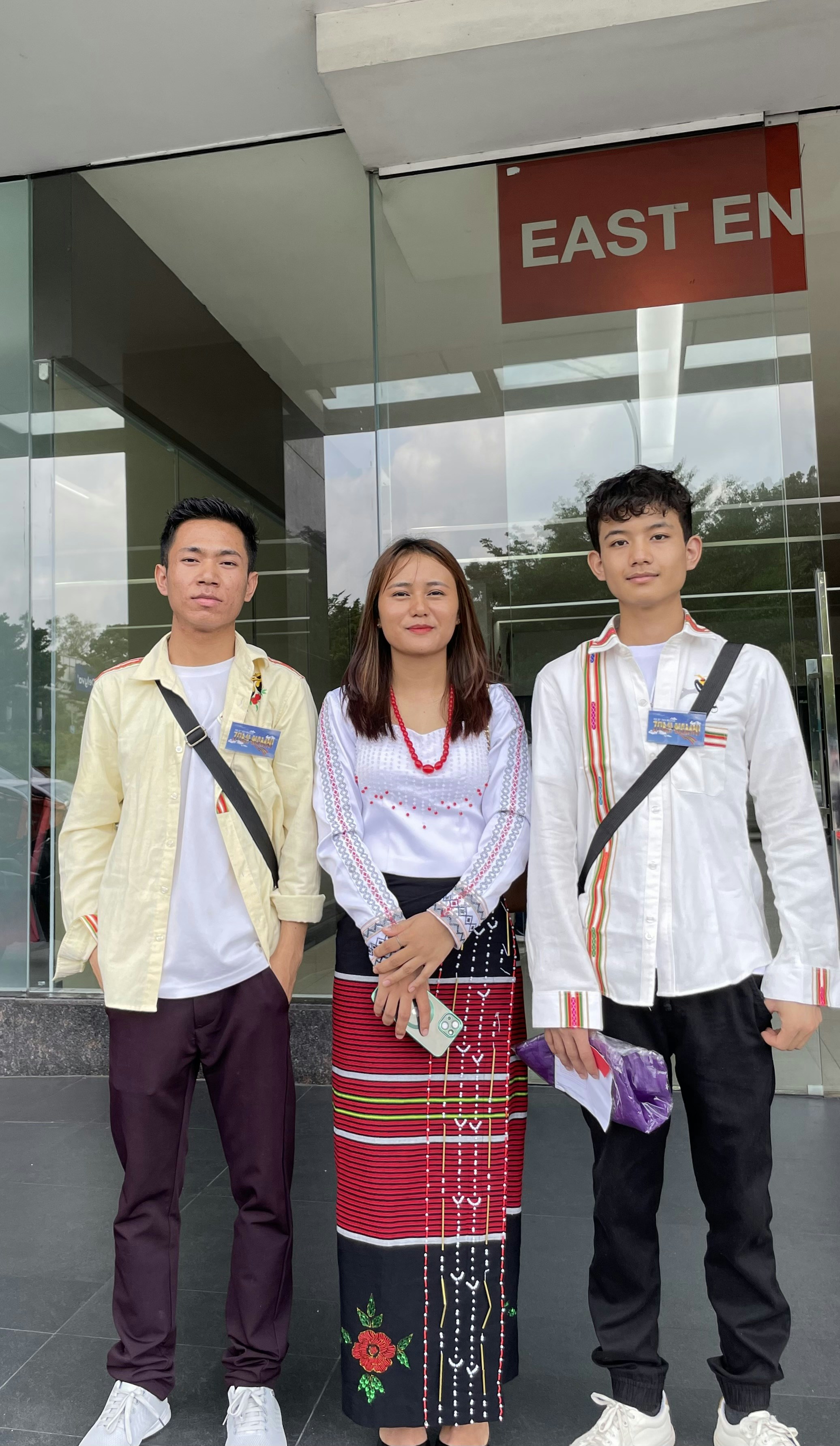A group of people standing in front of a building