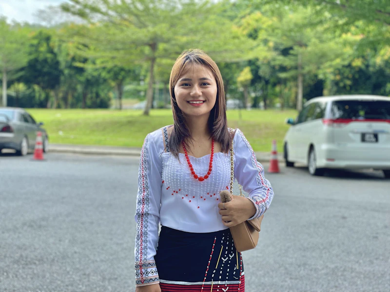 Confident Filipino Sugar Mommy in a parking lot