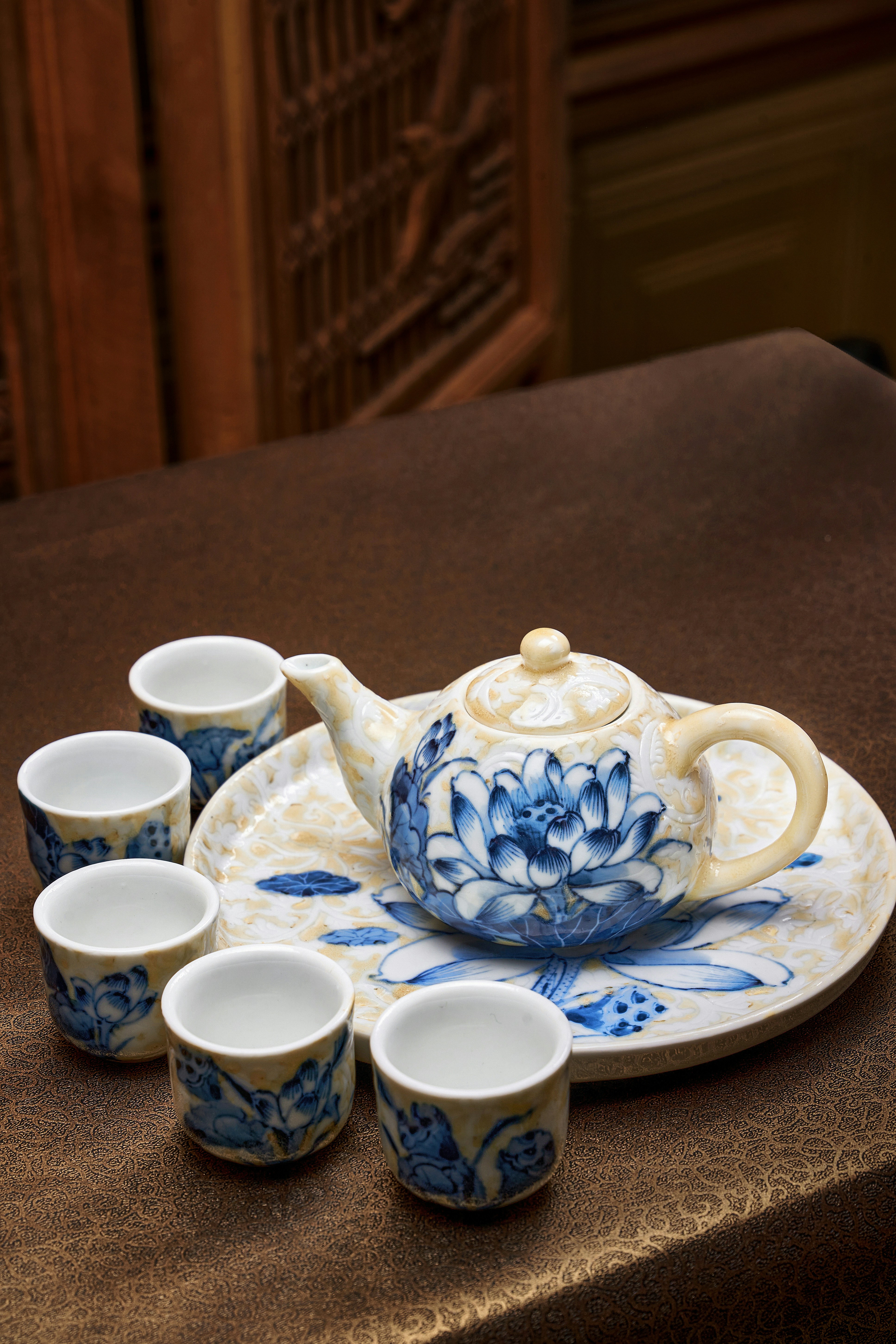A blue and white tea set on a table