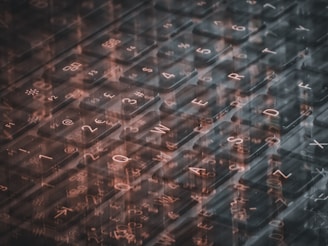 A computer keyboard with a lot of writing on it