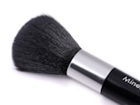 A close up of a brush on a white surface