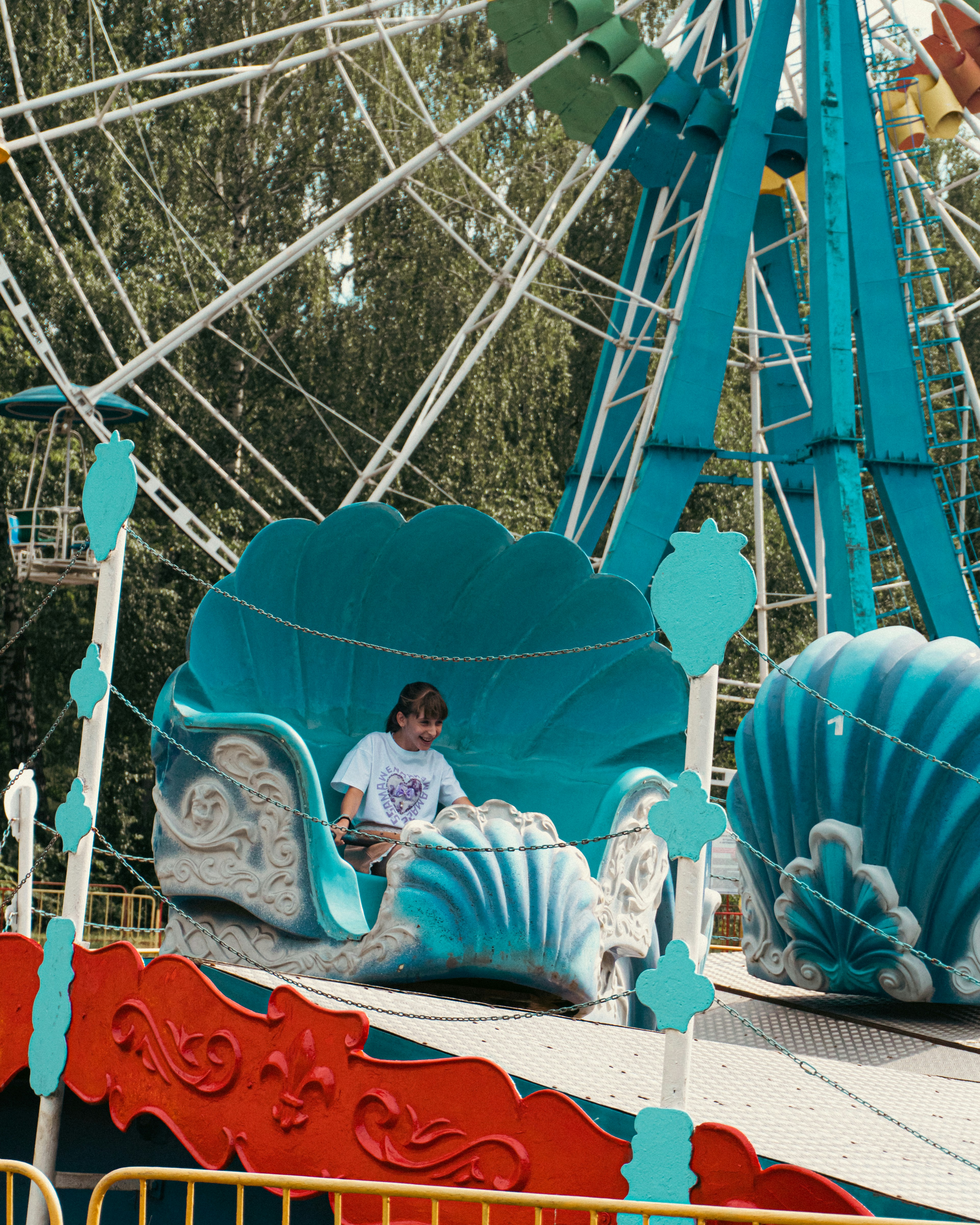 A carnival ride with a man riding on it