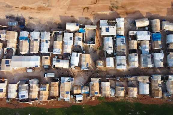 An aerial view of a lot of parked cars